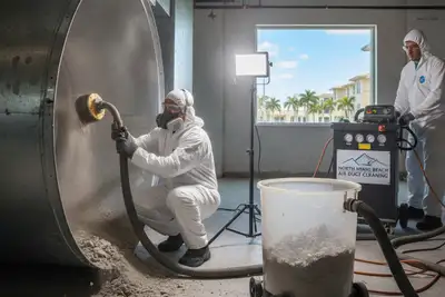Technician cleaning air ducts with pro equipment in North Miami Beach FL home for better AC performance
